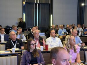 Trucking industry leaders attending a conference session